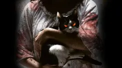 кадр з фільму Кішка, що бачить мертвих